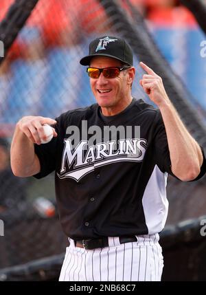 Former Miami Marlins player Jeff Conine waves to fans as he arrives for a  Miami Marlins baseball FanFest event, Saturday, Feb. 11, 2023, in Miami.  Conine is now a special assistant to