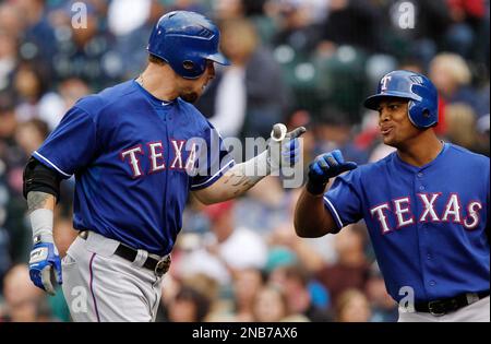 Texas Rangers' Josh Hamilton, left, is greeted by Adrian Beltre