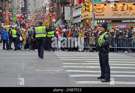 New York, USA. 12th Feb, 2023. Police officers direct traffic during Chinese New Year celebrations in Chinatown, New York City, the United States, on Feb. 12, 2023. The 25th Annual Chinatown Lunar New Year Parade and Festival was staged on Sunday, attracting people from various ethnic backgrounds. Credit: Li Rui/Xinhua/Alamy Live News Stock Photo