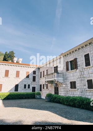 Two shuttered windows in the stone wall of the house, horizontal Stock ...