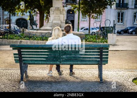 Lisbon, Portugal, October 26, 2016: A couple is enjoying an evening in Lisbon at Miradouro de Sao Pedro de Alcantara Stock Photo