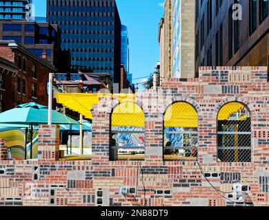 Arches in Brick Wall of Many Colors Stock Photo