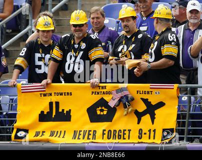 A Ravens fan in firefighter gear prays before the Pittsburgh Steelers play  the Baltimore Ravens at M&T Bank Stadium in Baltimore, Maryland on  September 11, 2011. UPI/Roger L. Wollenberg Stock Photo - Alamy