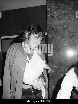 New York Jet quarterback Joe Namath stands with bowed head after being  injured in the first quarter of the Jets-Colt game at Memorial Stadium on  Sept. 23, 1973, in Baltimore, Maryland. Namath