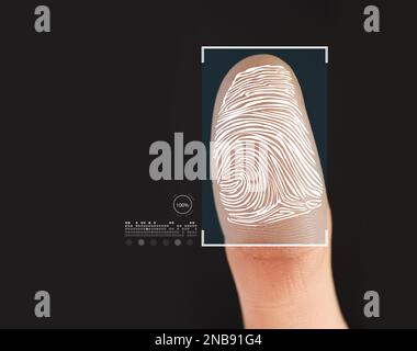 Man using biometric fingerprint scanner on black background, closeup Stock Photo