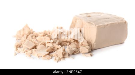 Crumbled block of compressed yeast on white background Stock Photo