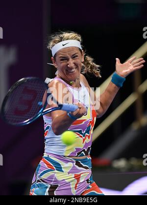 Doha, Qatar. 13th Feb, 2023. Victoria Azarenka of Belarus hits a return during the singles round of 32 match against Ipek Oz of Turkey at WTA500 Qatar Open 2023 in Doha, Qatar, Feb. 13, 2023. Credit: Nikku/Xinhua/Alamy Live News Stock Photo
