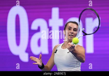 Doha, Qatar. 13th Feb, 2023. Ipek Oz of Turkey hits a return during the singles round of 32 match against Victoria Azarenka of Belarus at WTA500 Qatar Open 2023 in Doha, Qatar, Feb. 13, 2023. Credit: Nikku/Xinhua/Alamy Live News Stock Photo