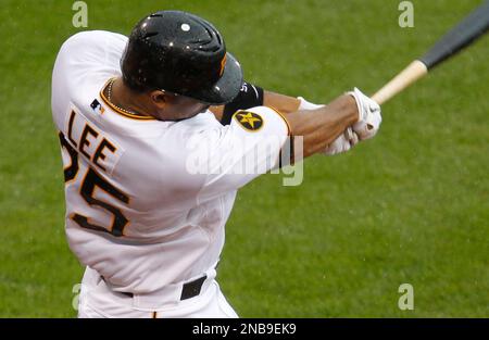 Pittsburgh Pirates' Derrek Lee hits an RBI single against the Chicago Cubs  during the first inning of a baseball game on Saturday, Sept. 3, 2011, in  Chicago. (AP Photo/Nam Y. Huh Stock