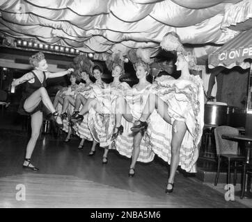 https://l450v.alamy.com/450v/2nba5m6/on-the-job-as-night-club-choreographer-diane-mason-former-dancer-and-showgirl-shows-the-bal-tabarin-montmartre-can-can-dancers-a-new-version-of-the-old-dance-in-new-york-on-dec-5-1953-the-girls-are-right-to-left-joli-roberts-jackie-cook-gerrie-still-anne-stevens-rita-leonard-and-jackie-bernard-diane-is-also-costume-designer-for-the-new-york-night-clubs-shows-in-addition-she-keeps-house-for-her-husband-and-their-two-young-daughters-and-studies-musical-arranging-ap-photorobert-kradin-2nba5m6.jpg