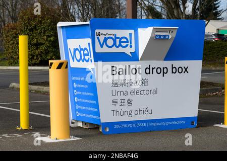 Renton, WA, USA - February 12, 2023; King County drive up ballot drop box with yellow protective posts Stock Photo