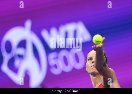 Doha, Qatar. 13th Feb, 2023. Veronika Kudermetova of Russia serves during the singles round of 32 match against Barbora Krejcikova of the Czech Republic at WTA500 Qatar Open 2023 in Doha, Qatar, Feb. 13, 2023. Credit: Nikku/Xinhua/Alamy Live News Stock Photo