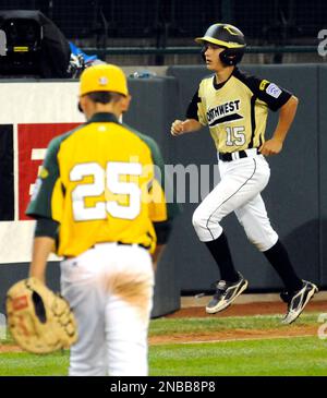 Huntington Beach, Calif.'s Nick Pratto, center, is mobbed by