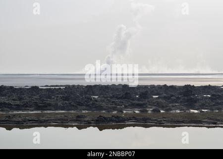 Panorama of the Sidoarjo mud or Lapindo mud is a hot mud eruption event, Sidoarjo in East Java, Indonesia that has been in eruption since May 2006. Stock Photo