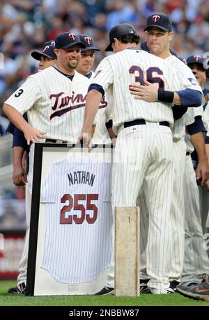 Minnesota Twins' Joe Nathan, right, congratulates catcher Joe