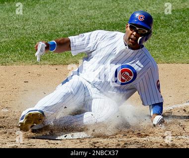 The Washington Nationals' Alfonso Soriano scores in front of Chicago Cubs'  pitcher Mark Prior after a wild pitch in the first inning of their game at  RFK Stadium in Washington, DC, on