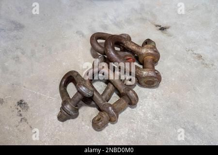 Old rust chain links isolated on the concrete background Stock Photo