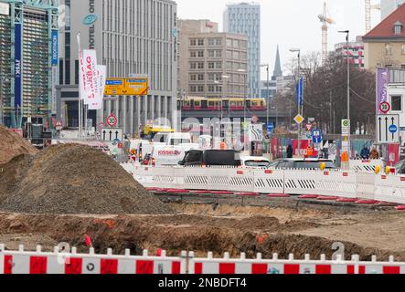 Berlin, Germany. 13th Feb, 2023. Red and white barriers are in place at the Molkenmarkt construction site in front of Sandbergen. In the background, the Rathauspassagen parking garage (l) can be seen, as well as the Motel One hotel and other commercial buildings on Alexanderplatz. According to a development plan adopted in 2016, urban restructuring is being carried out in the area in the Mitte district between Mühlendamm Bridge, Littenstrasse, Molkenmarkt, Klosterstraße and Spandauer Straße. Credit: Soeren Stache/dpa/Ģ����ý Live News Stock Photo