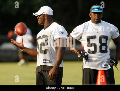 Carolina Panthers linebackers coach Ken Flajole gives instructions to  rookie Jon Beason during Beason's first practice at training camp in  Spartanburg, South Carolina, Monday, August 6, 2007. (Photo by David T.  Foster