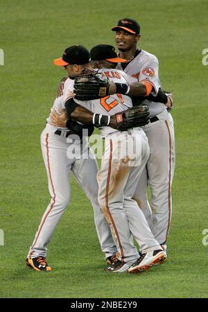 Baltimore Orioles outfielders Felix Pie, Nick Markakis (21) and Adam Jones  (10) celebrate after the Orioles defeated the New York Yankees 6-2 in a  baseball game Tuesday, Sept. 7, 2010, at Yankee