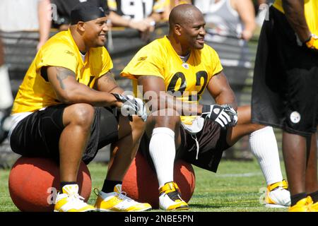 Pittsburgh Steelers linebacker LaMarr Woodley (56) and Stevenson Sylvester,  right rear, arrive for the first day of NFL football camp in Latrobe, Pa.,  Friday, July 29, 2011. (AP Photo/Gene J. Puskar Stock