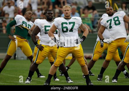 In this Sept. 2, 2010, photo, Green Bay Packers lineman Nick McDonald (67)  gets ready to block in front of quarterback Matt Flynn during a preseason NFL  football game against the Kansas