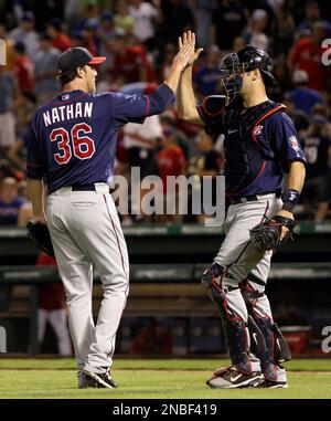 Minnesota Twins catcher Joe Mauer, right, and Justin Morneau congratulate  closer Joe Nathan, who made the last out against the Detroit Tigers at the  Metrodome in Minneapolis, Minnesota, Thursday, May 14, 2009.