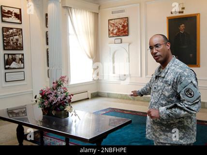 U.S. Army Col. Norvell V. Coots gestures during an interview in the main lobby of the Walter Reed Army Medical Center in Washington, Thursday, July 21, 2001. Walter Reed Army Medical Center, the military's flagship hospital where privates to presidents have gone for care for more than a century, is closing its doors. Hundreds of thousands of the nation's war wounded from World War I to today have received treatment at Walter Reed, including 18,000 troops who served in Iraq and Afghanistan. (AP Photo/Luis M. Alvarez)