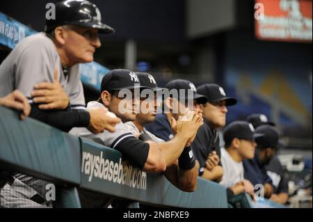 New York Yankees watch from the dugout during the ninth inning of their 4-0 win in a baseball game against the Tampa Bay Rays on Wednesday, July 20, 2011, in St. Petersburg, Fla. (AP Photo/Brian Blanco)
