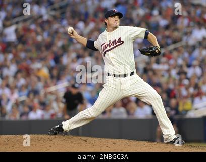 Minnesota Twins catcher Joe Mauer, left, and relief pitcher Joe Nathan  celebrate their 7-4 win over the Chicago Cubs after an interleague baseball  game, Friday, June 12, 2009 at Wrigley Field in