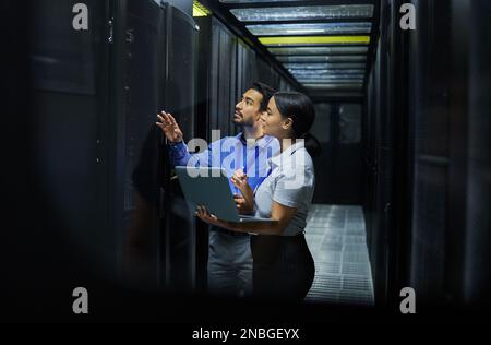 Server room, network laptop and people software management, system upgrade and cyber security. Teamwork technician, engineering or programmer staff on Stock Photo