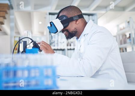 The future turns science fiction into fact. a scientist using a virtual reality headset while conducting research in a laboratory. Stock Photo