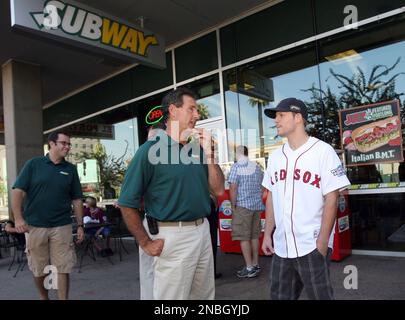 Boston Red Sox fan Lynn Hendrickson of Nashua, N.H. reacts as she is  introduced while modeling the new alternate home uniform jersey in Boston  Thursday, Dec. 11, 2008. (AP Photo/Elise Amendola Stock