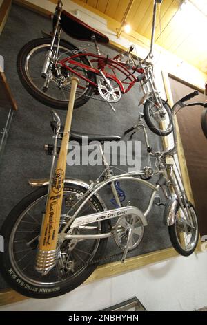 A Schwinn Stingray Grey Ghost bottom with a wire baseball bat