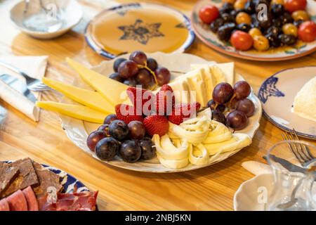 Ramadan table. The sahur table with cheese varieties, salami, pastrami, roasting, olives and tea Stock Photo
