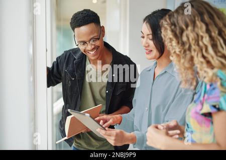 As technology evolves, so should your online and digital marketing. a group of businesspeople using a digital tablet together in an office. Stock Photo