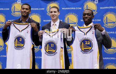 Golden State Warriors draft picks Jeremy Tyler, from left, Klay Thompson,  and Charles Jenkins hold up NBA jerseys as they are photographed at a news  conference in Oakland, Calif., Monday, June 27, 2011. (AP Photo/Jeff Chiu  Stock Photo - Alamy