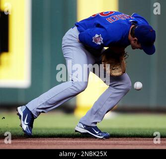 Chicago Cubs second baseman DJ LeMahieu (33) is charged with an error in  the second inning that allowed Milwaukee Brewers right fielder Corey Hart  (1) to get to first base at Wrigley