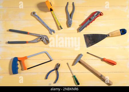 All tools supplies home construction on the yellow wooden background. Building tool repair equipments,copy space,industry engineer tool concept.still- Stock Photo