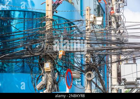 A tangle of utility wires in Ho Chi Minh City, Vietnam. Stock Photo