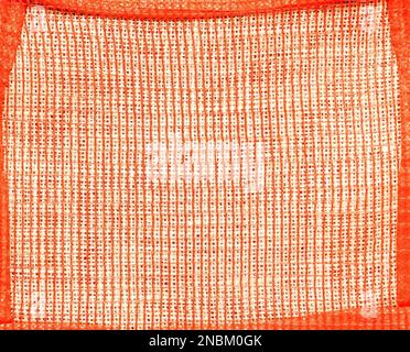 Abstract background of burlap covered with red mesh in a red frame Stock Photo