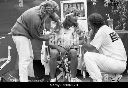 Australian Open Tennis Championships 1991 Steffi Graf has her injured arm prayed on court  Photo by Tony Henshaw Archive Stock Photo