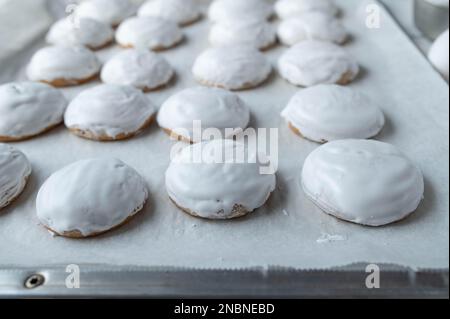 Gingerbread cookies on a baking sheet. Closeup, front view, Stock Photo