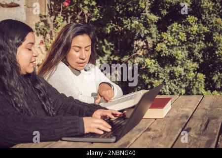 two women working outdoors in the park Stock Photo
