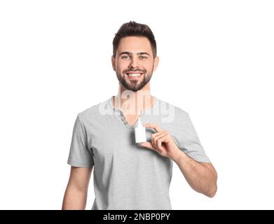 Man with nasal spray on white background Stock Photo