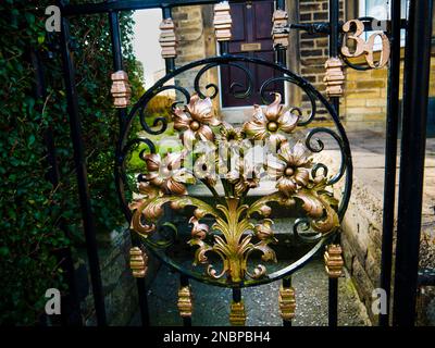 This gate is a triumph of the Blacksmith's art with its flowers so  beautifully made. It is a Work of Art in Burnley  Lancashire Stock Photo