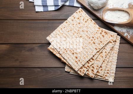 Stack of matzos on wooden table, flat lay Stock Photo