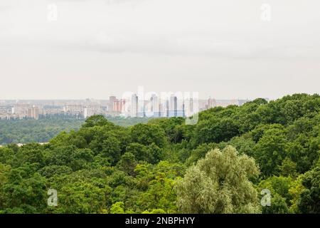 Kyiv, Ukraine. July 19. 2014. Cityscape of Kyiv, view of the left bank and the Dnieper River. Modern city in the distance, evening time. Stock Photo