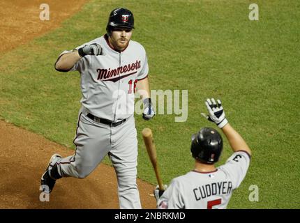 Minnesota Twins' Jason Kubel (16) celebrates his grand slam off