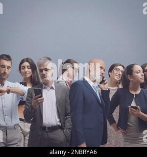 Group of diverse people using smartphones, technology and lifestyle concept Stock Photo